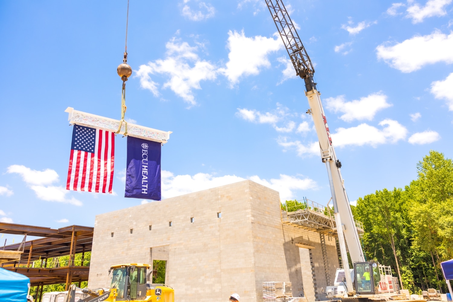 Signed beam raised into place at upcoming behavioral health hospital